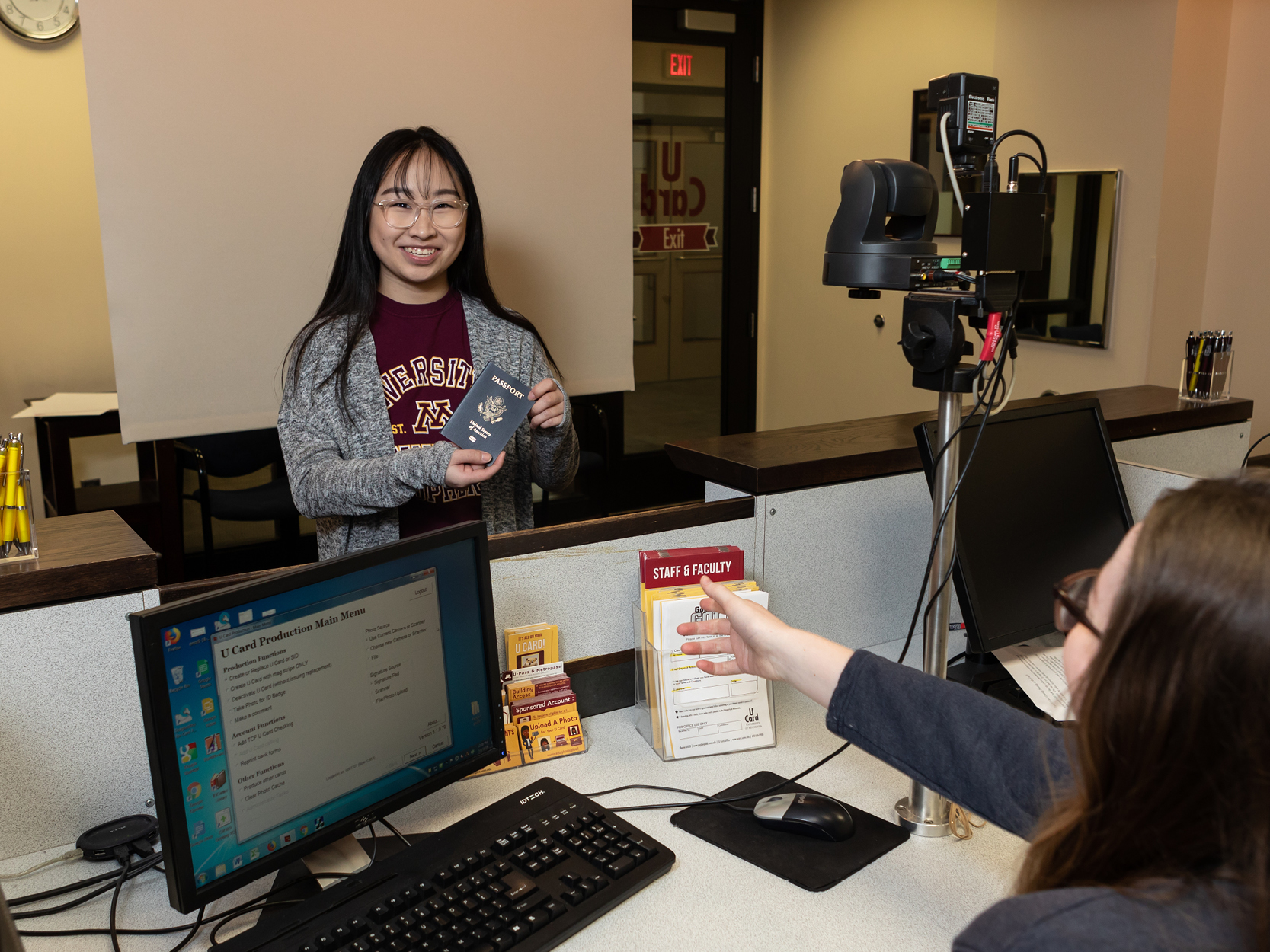 Student providing their passport at the U Card Office